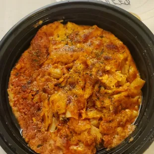 Dry overcooked grease-filled flavorless baked ziti - complete with nasty orange cheese. This pasta didn&apos;t taste Italian at all.