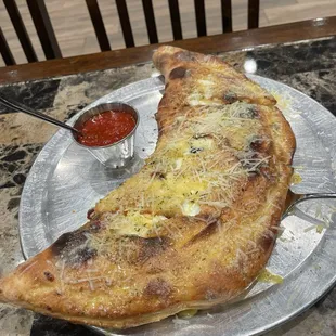Calzone with olives, pepperoni and I added an extra topping of pineapple