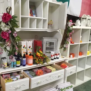 a display of flowers and products