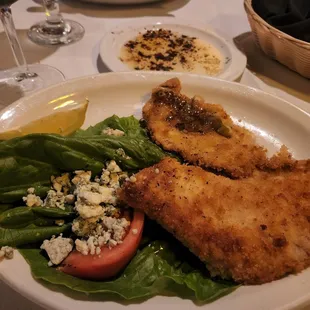 The veal with lemon and tomato sauce with feta  No sauce. That&apos;s not feta.