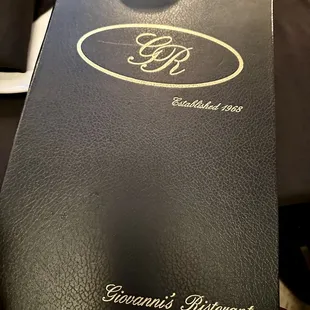 a wine glass and menu