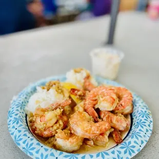 a plate of shrimp and rice