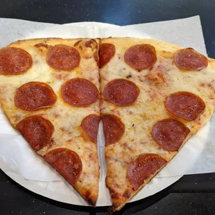 Two slices of pepperoni pizza