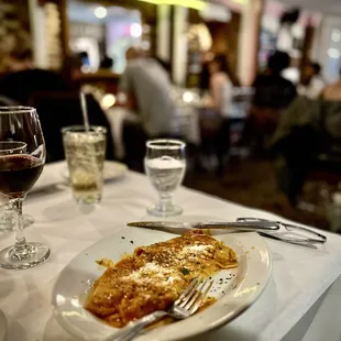 Seated at a table in the back of the restaurant