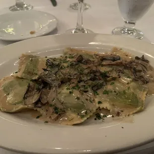 Agnolotti Di Casa Mia topped with cream sauce and porcini