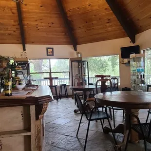 a dining area with tables and chairs
