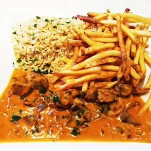 Stroganoff: mushroom + sour cream sauce and beef served with rice and fries logically.