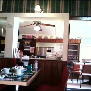 a view of a kitchen and dining room
