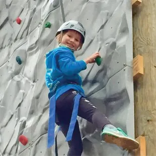 Girl Scout on the climbing wall at Camp Darden
