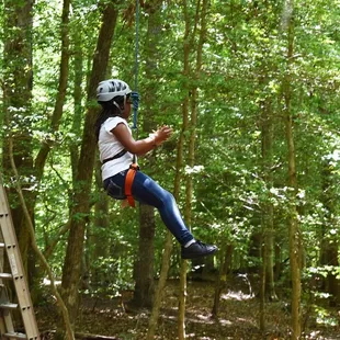 Girl Scout on the high ropes course at Camp Skimino