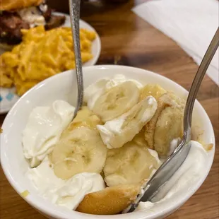 a bowl of bananas and whipped cream
