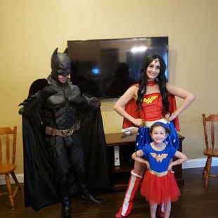 Wonder Woman and Batman with the birthday girl.