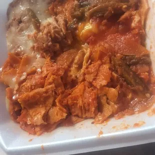 Ordered red enchiladas that was just tortilla chips drenched in that same bland tomato sauce they used on the &quot;relleno&quot;, with bell peppers.