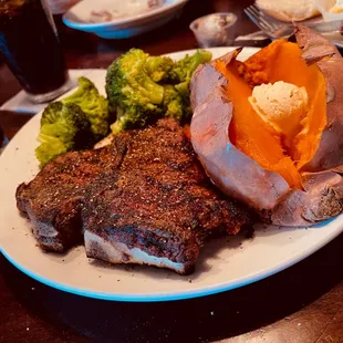 TBone steak dinner with sweet potato and steamed broccoli