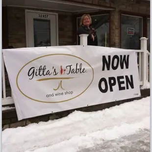 Owner Gitta announcing her grand opening.