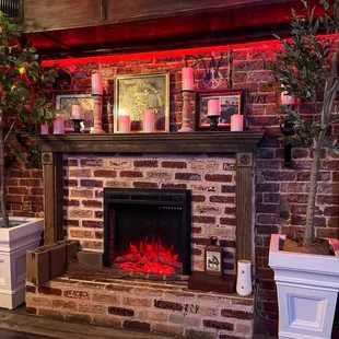 a brick fireplace with red lights