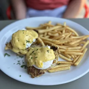 Crab eggs Benedict with a side of fries