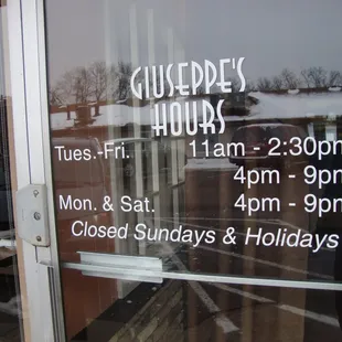 Hours of operation, front entry door.