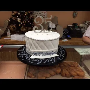 a white cake on a black plate