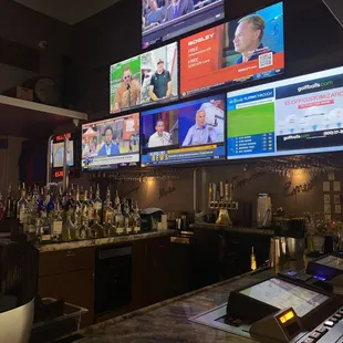 a bar with multiple televisions