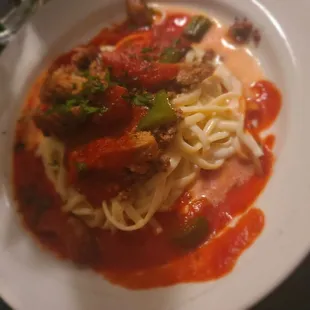 a plate of spaghetti and meat