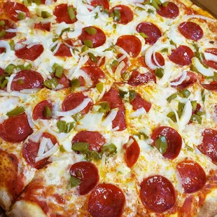 Pepperoni peppers onion cheesy pizza