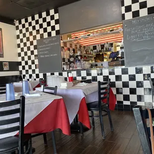 a restaurant with checkered walls