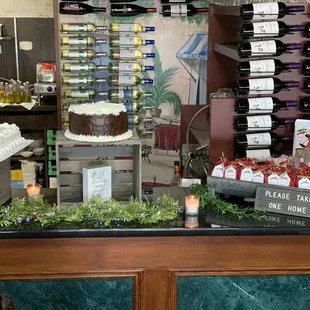 a counter with a cake and candles