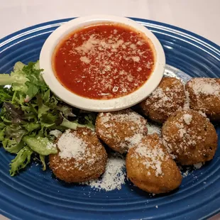 Arancini which comes with tomato sauce for dipping and lettuce