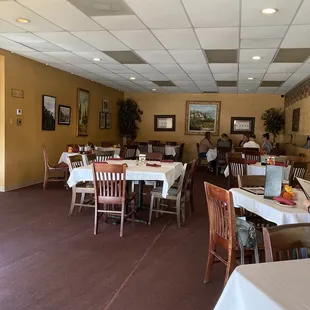 a dining room with tables and chairs