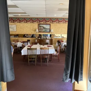 a dining room with tables and chairs