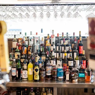 a large collection of wine bottles