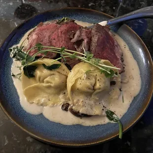 Strip loin with mushroom crème sauce and manchego cheese tortellini.
