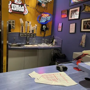 a counter with pizzas on it