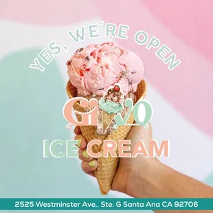 a hand holding an ice cream cone