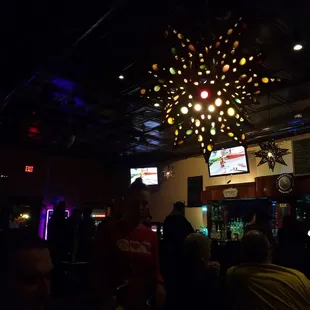 a crowd of people in a bar