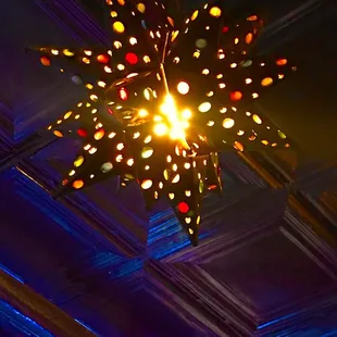 a brightly lit chandelier hanging from the ceiling