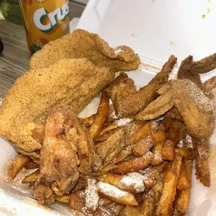 Chicken wings, catfish, and fries
