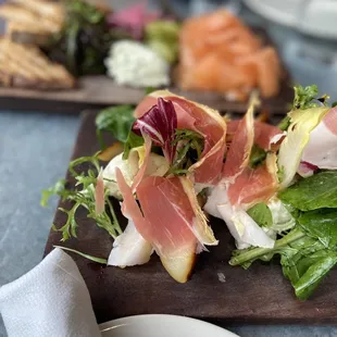 Roasted Warren Pear, Burrata, Arugula, Treviso, Prosciutto &amp; Bacon Vinaigrette  Smoked Salmon in the back