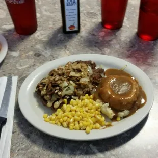 GJ&apos;s delicious sirloin chop steak with corn, mashed potates w/gravy,comes with salad or coleslaw, mushrooms and onion on the steak are extra