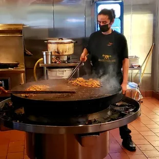 a man cooking in a kitchen