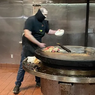 a man preparing food in a kitchen