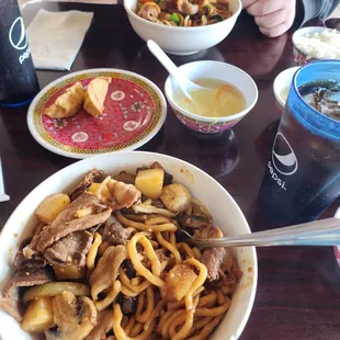 Our noodle bowls that we conjured up, along with the egg flower soup, white rice, and some potstickers.....don&apos;t forget the Diet Pepsi.