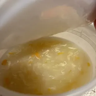 egg flower or egg drop soup. It was included with my remake of my food bowl along with sweet-and-sour sauce and a side of rice.