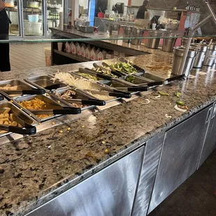 a buffet with a variety of food items