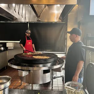 a man preparing food in a restaurant kitchen