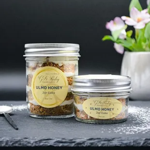 a jar of granola honey next to a jar of granola honey