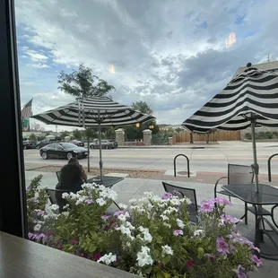 Street view from the front window of Glacier.  Three stools are at the high counter top, facing the street.