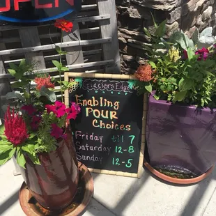 open sign and flowers