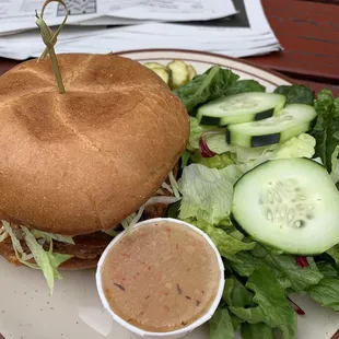 Veggie burger buffalo style with a side salad